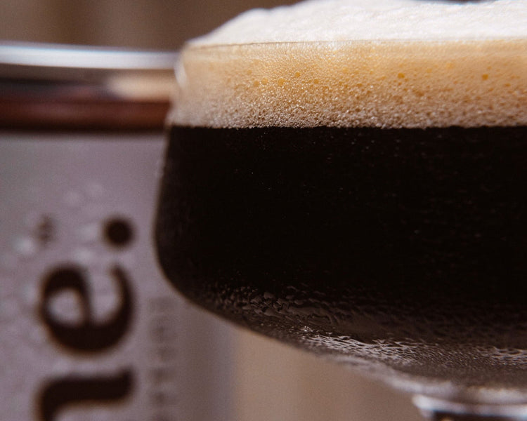 CLOSE UP OF CAN AND COCKTAIL SIP TORNE. ESPRESSO MARTINI 